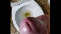 Straight guy with big uncut cock pissing while stroking then cums Thumb