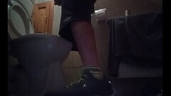 Sporty guy peeing at home Thumb