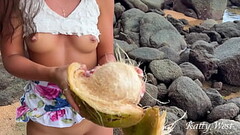 Naked girl found a coconut on a public beach and poured the juice over her body Thumb