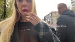 A girl shows her breasts while walking in public in the city Thumb