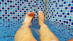 Feet in the pool with water Thumb