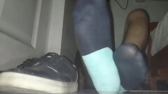 Blue sweaty socks and barefeet Thumb