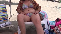 Opening Part - My 58 year old hairy wife shows off in bikini on the beach, masturbates, wants to fuc Thumb