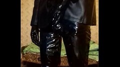 Guy in latex mask and latex shorts, vinyl pants and gloves Thumb